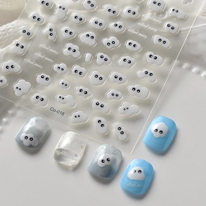 3D embossed cartoon white cloud nail stickers with cute eye designs for DIY manicures