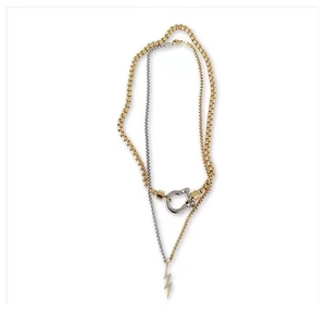Gold and silver layered chain necklace with horseshoe buckle and crystal lightning pendant