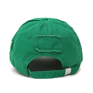 Detail of the adjustable silver metal buckle and distressed fabric on the green cotton cap