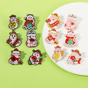 Detailed view of colorful cartoon snake enamel pins with traditional Chinese New Year symbols