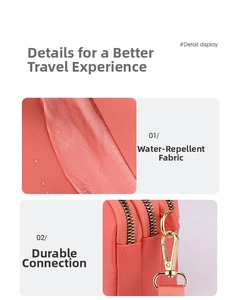 Detail view of water-resistant fabric and gold metal zippers on coral pink crossbody bag