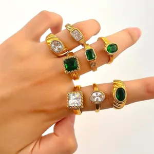 Set of 7 vintage gold stainless steel rings with green and clear zircon gemstones