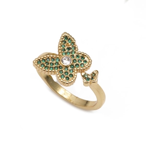Bague ajustable papillon doré avec zircons verts et cristaux pavés sur fond blanc