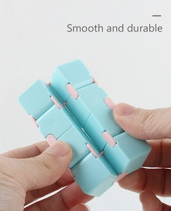 Macro shot of smooth infinity cube in blue and pink showing durable folding joints