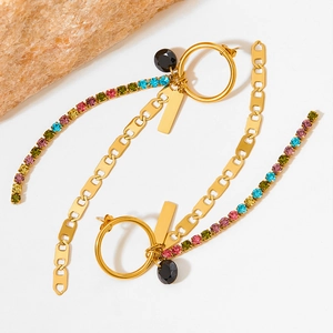 Gold stainless steel earrings with colorful rhinestones and black round charms on a stone