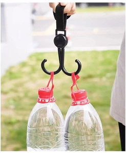 Dual heavy-duty plastic hooks on nylon strap lifting two large water bottles outdoors