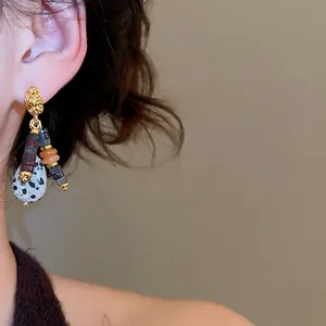 Ethnic style beaded dangle earrings featuring natural stones and a retro gold-tone finish