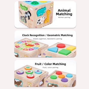 Detail view of wooden busy box toy featuring animal puzzle and clock learning dials
