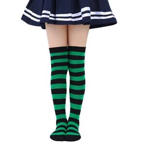 Detailed view of green and black striped knit over-the-knee socks for children