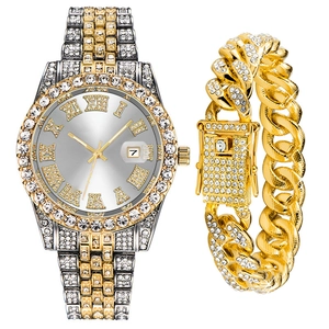Close-up of iced-out men's watch and Cuban bracelet set with luxury crystals