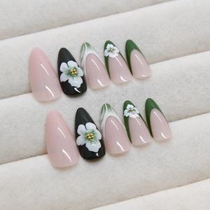 French press-on nails with dark green almond shape and 3D floral gemstone decorations