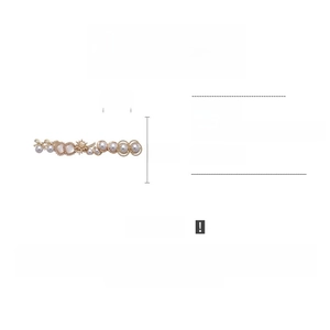 Detail of vintage earring with pearls, resin, and rhinestones in gold setting