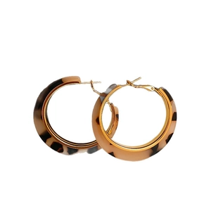 Fashionable leopard print resin C-shaped hoop earrings with golden needles on white background