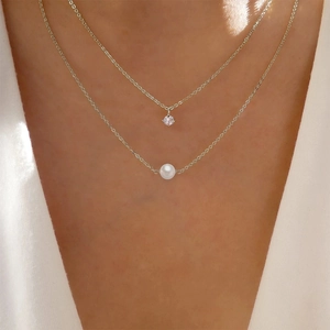 Elegant double-layered silver necklace with white freshwater pearls and zircon pendant