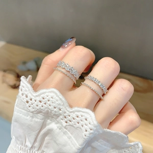 Minimalist silver ring set with four elegant bands and subtle gemstones for women
