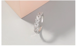 Detailed view of silver adjustable heart ring featuring sparkling white zircon accents