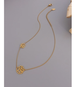 Detailed macro of 14K gold plated lobster clasp and double rose flower pendants