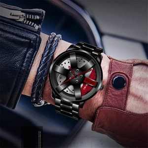 Close-up of car wheel hub design dial with red brake caliper and black metal strap