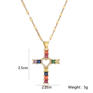 Detailed size view of gold cross pendant with colorful gems and heart cutout, 3.5cm height