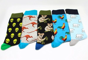 Detailed view of colorful mid-calf socks with animal patterns and reinforced contrast heels