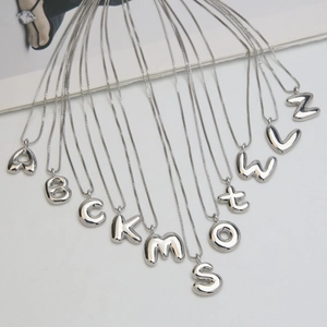 Polished silver balloon style letter necklace collection with puffy alphabet pendants