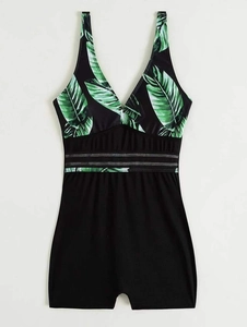 Detail of leaf print one-piece swimsuit with semi-transparent mesh waist paneling