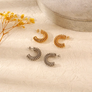 Twisted spring hoop earrings in gold and silver stainless steel finish for women