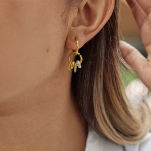 Elegant gold and silver multi-hoop earrings worn by a model for a luxury style look