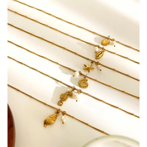 Golden titanium steel necklace set with ocean pendants, pearls, starfish and shells