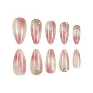 Pink marble press-on nails with 3D gold textured relief and almond shape design