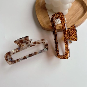 Minimalist square hollow hair claw clips in leopard and marble patterns for women
