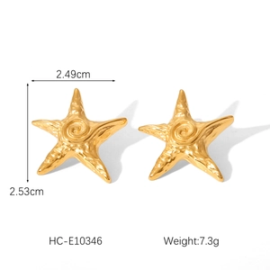 Detailed view of hammered 18k gold star stud earring with measurements and texture