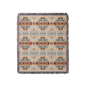 Bohemian woven picnic blanket with geometric tribal patterns and colorful tassels