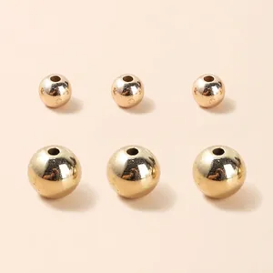 Polished gold acrylic beads in two sizes for DIY jewelry making and bracelet assembly
