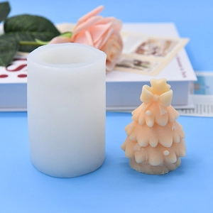 Christmas tree silicone mold for DIY cake making with finished bow-topped resin tree