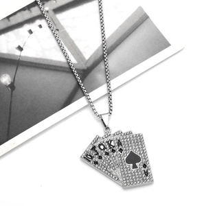 Detail of silver poker cards pendant featuring sparkling diamonds and street style design
