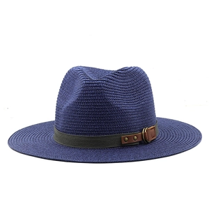 Detail of dark blue straw hat featuring grey ribbon with brown leather and metal buckle