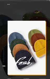 Close-up of ribbed knit beanies in multiple colors like navy, green and yellow