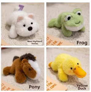 Close-up of four plush animal fridge magnets in cute lying poses on a beige rug