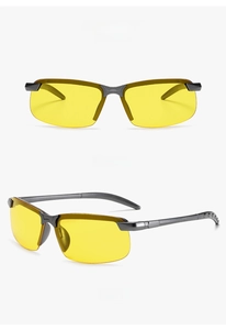 Macro detail of men's night vision driving glasses with gunmetal semi-rimless metal frame