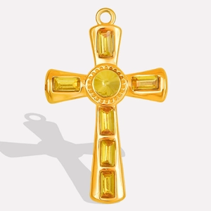 Detail of a gold 304 stainless steel cross pendant with yellow crystals on white background