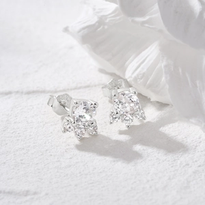 Close-up of S925 sterling silver cat paw stud earrings with sparkling cubic zirconia