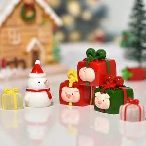Christmas miniature resin set featuring cute pig gift boxes and a classic snowman figurine
