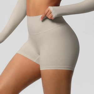 Detail showing the seamless high-waisted waistband on the beige yoga fitness shorts