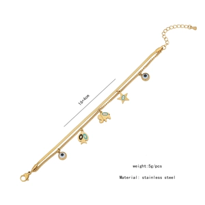 Détails du bracelet double chaîne en acier inoxydable doré avec breloques œil et étoile
