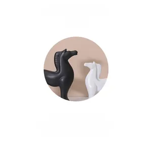Close-up of abstract ceramic horse sculptures with smooth minimalist art lines