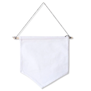 Detail of white canvas wall banner with wooden bar and black-and-white cotton rope