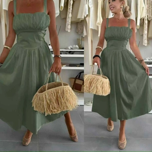 Detail of elegant dark green strapless midi dress with natural pleats and belted waist