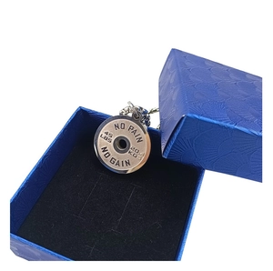 Silver barbell weight plate necklace with 'No Pain No Gain' in a blue gift box