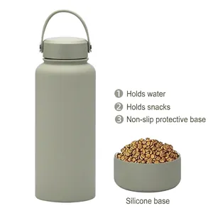 Green 1L insulated sports water bottle with a detachable silicone pet snack base